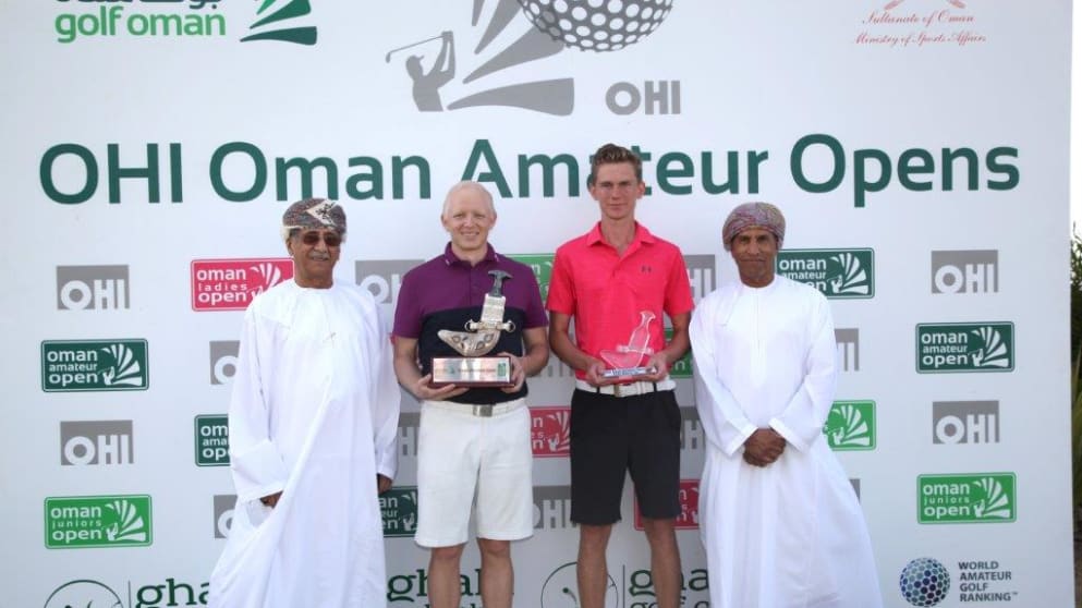 Max Burrow and Mikkel Mathiesen receive their trophies from Maqbool Al Saleh, Chairman of OHI and Mundhir Al Barwani, Chairman of Oman Golf Committee