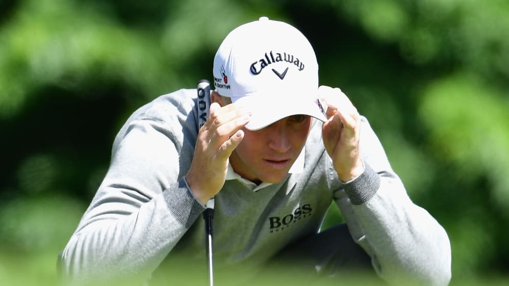 Alex Noren lining up a putt during his third round