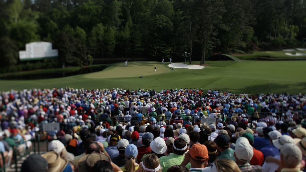 Crowds gather round the 11th green at Augusta