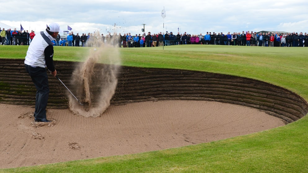 Paul Lawrie plays a shot from the bunker 