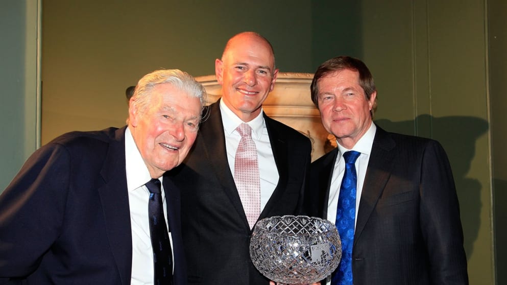 Peter Fowler (C) of Australia receives the John Jacobs Trophy 