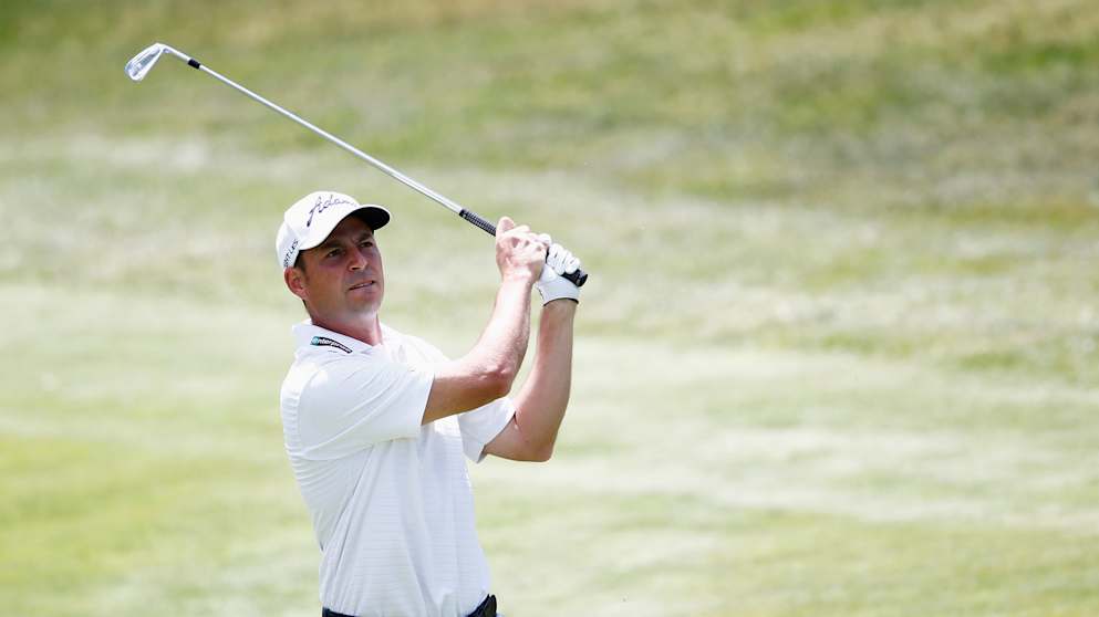 David Howell hits his approach to the second