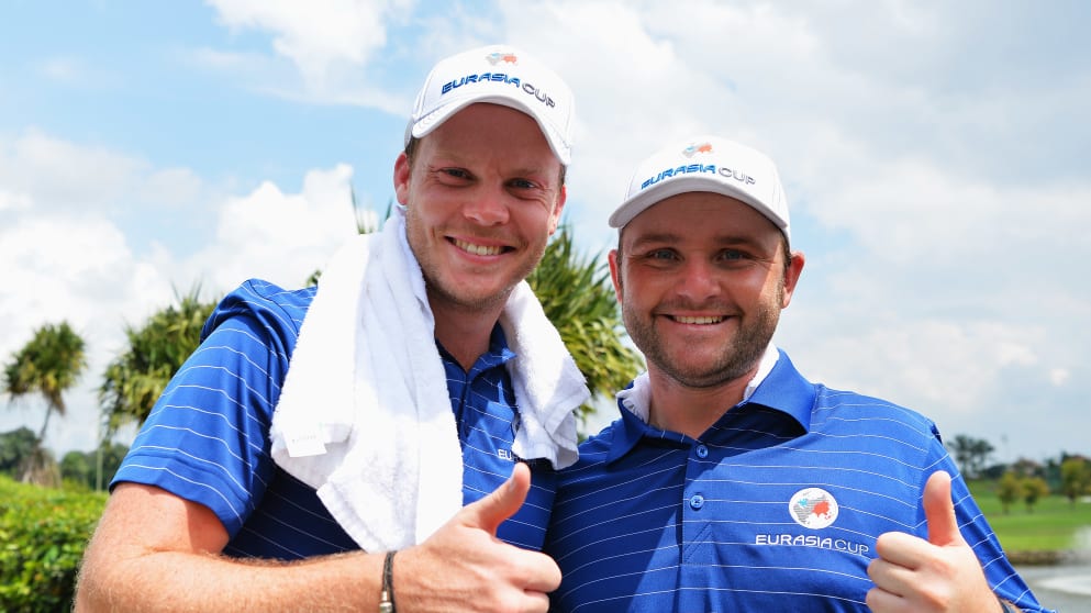 Danny Willett celebrates with Andy Sullivan after winning the 2016 EurAsia Cup