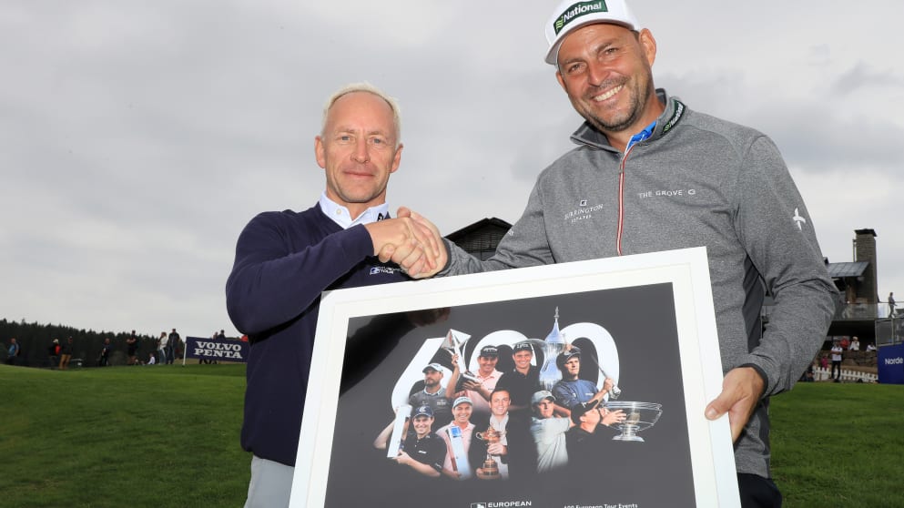 Mikael Eriksson presents David Howell with a print to mark his 600th appearance