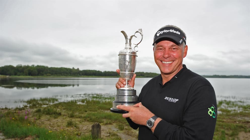   Darren Clarke of Northern Ireland poses with the Claret jug 