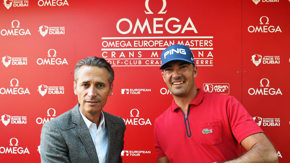 Raynald Aeschlimann, Vice President of Omega presents Gregory Havret with an Omega watch