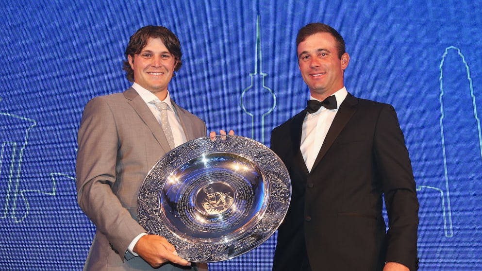 Peter Uihlein (L) receives the 2013 Sir Henry Cotton Rookie of the Year award from 2012 winner Ricardo Santos during the Players' Awards 