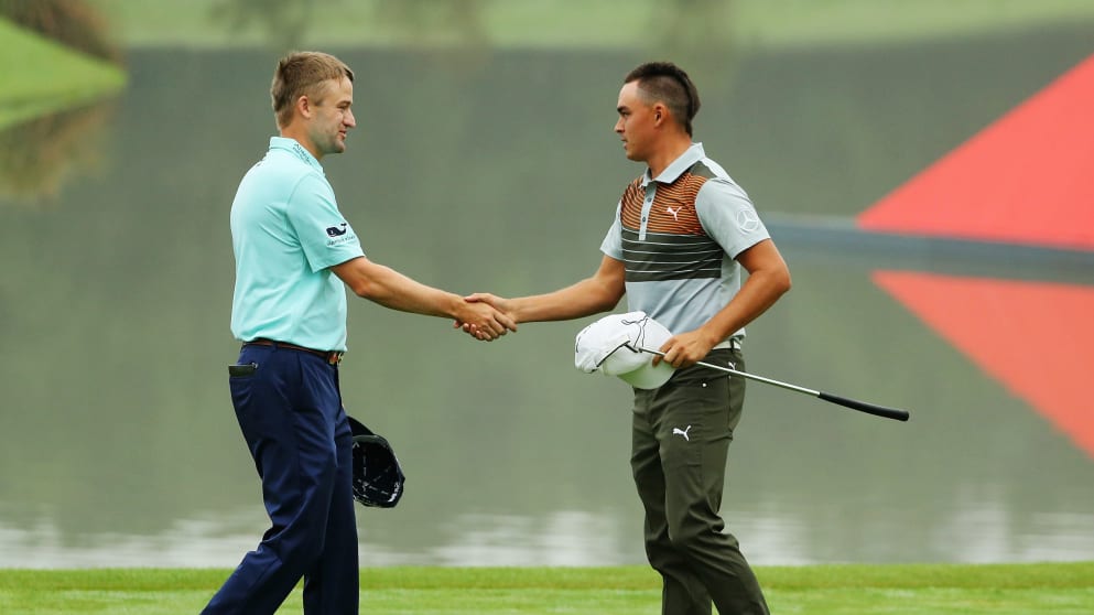Russell Knox and Rickie Fowler shake hands after the first round in China