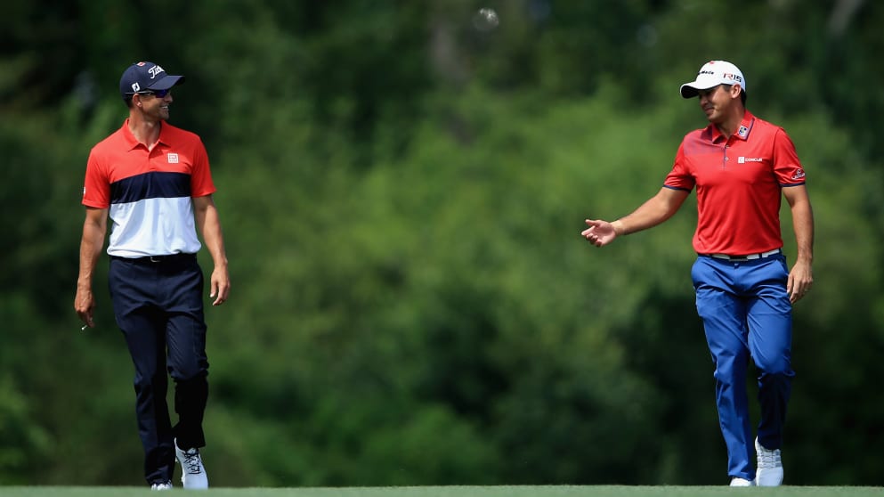 Australians Adam Scott and Jason Day walk up the fifth fairway at the Masters