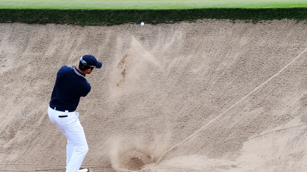 Grégory Bourdy plays out of a bunker on the 16th