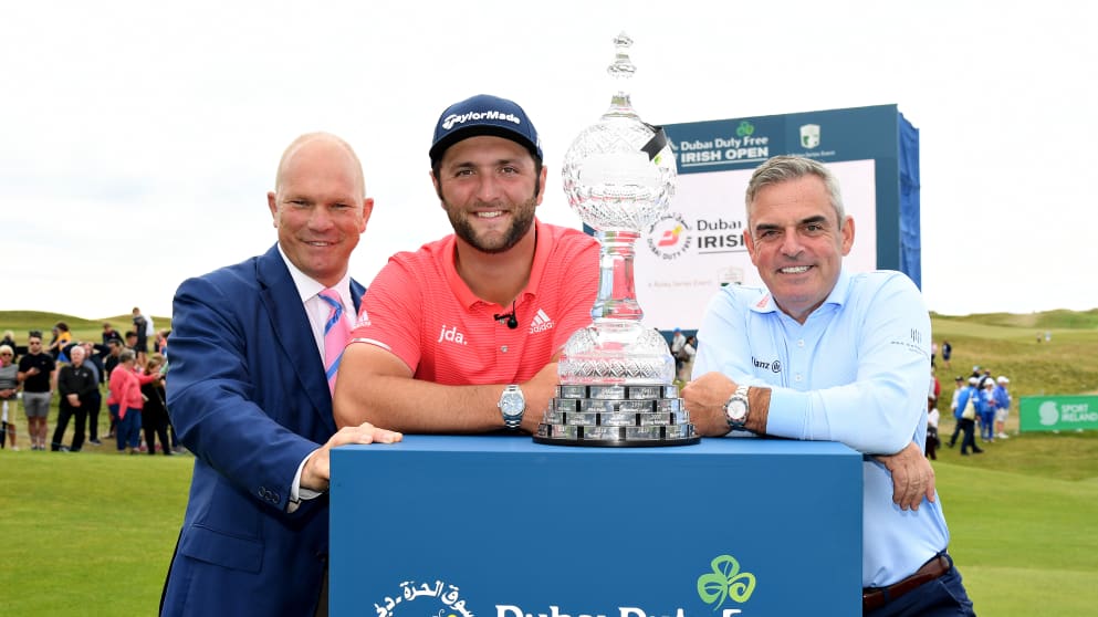 Jon Rahm (centre) with Guy Kinnings (left) and Paul McGinley (right)