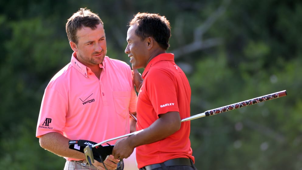 Thongchai Jaidee congratulates Graeme McDowell after his 2&1 victory