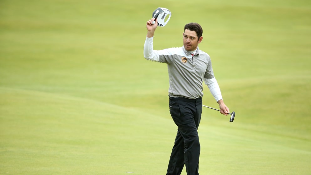 Louis Oosthuizen waves on the 18th after making birdie for the play-off
