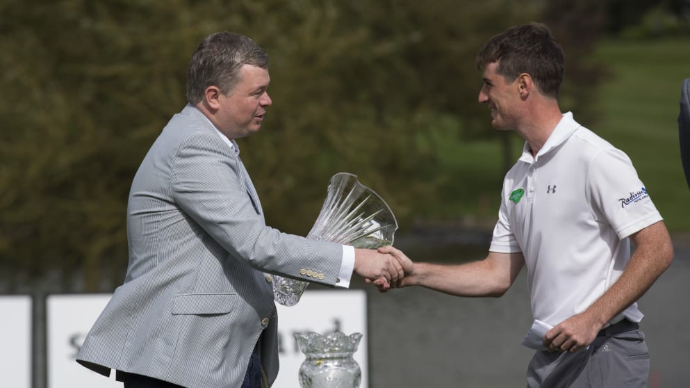 Dermot McElroy receives the Christy O'Connor Jr Memorial Trophy
