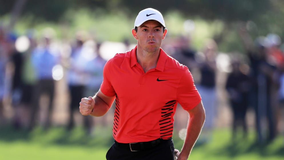 Rory McIlroy - celebrates after chipping in for birdie on the 17th hole in Abu Dhabi
