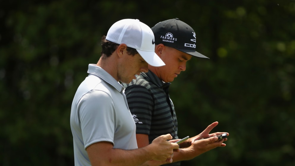 Rory and Rickie on their phones