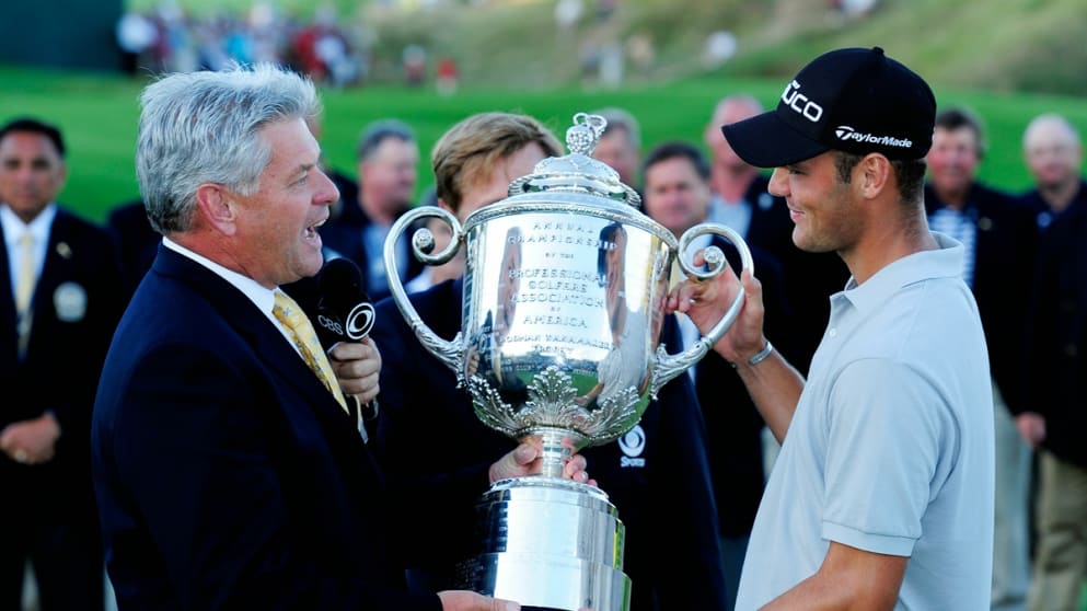 PGA of America President Jim Remy (L) presents the Wanamaker Trophy to Martin Kaymer