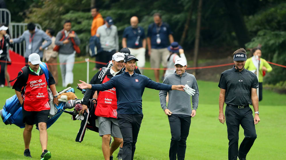Adam Scott, Rory McIlroy and Bubba Watson walk down the 1st hole at the WGC-HSBC Champions in Shanghai