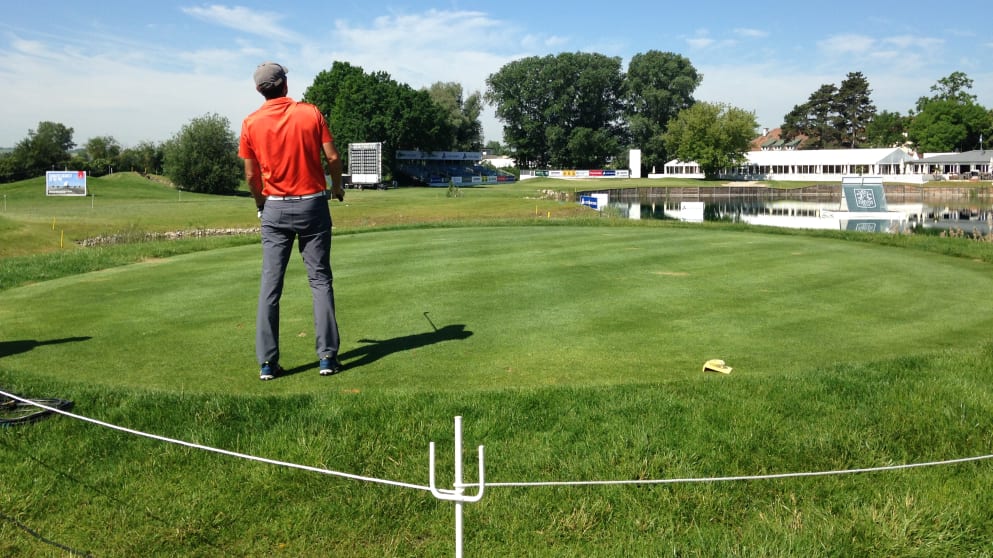 An amateur tees off on the 18th