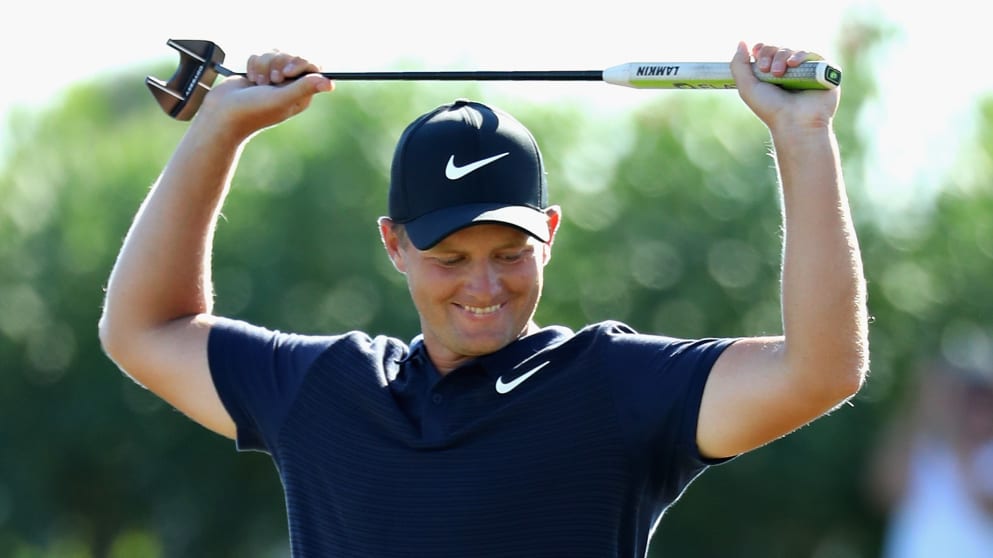 Tom Lewis of England celebrates his win