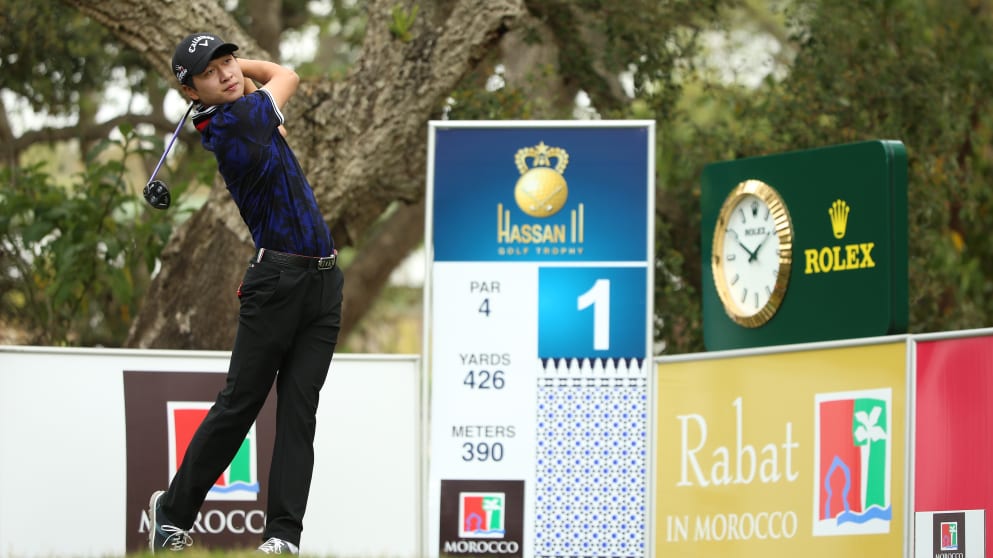 Wang tees off on the first hole