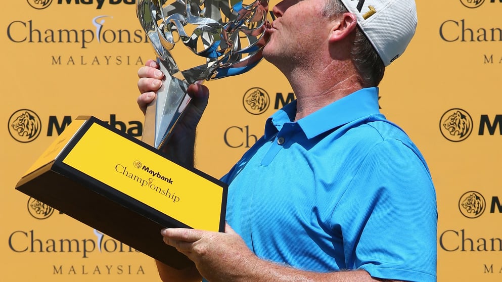 Marcus Fraser - celebrates with the trophy after winning the Maybank Championship Malaysia 