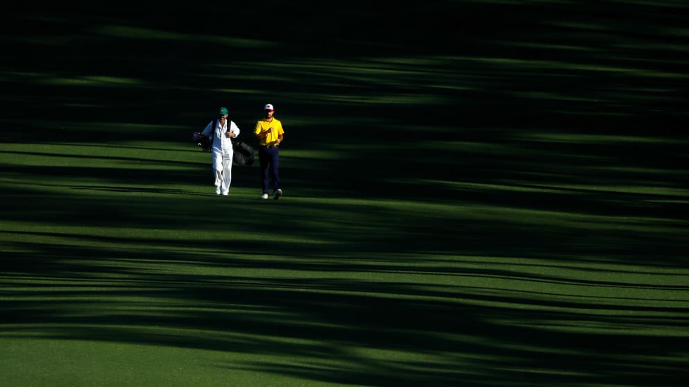 Curtis Luck - walks with his caddie on the second hole during a practice round prior to the start of the 2017 Masters Tournament 