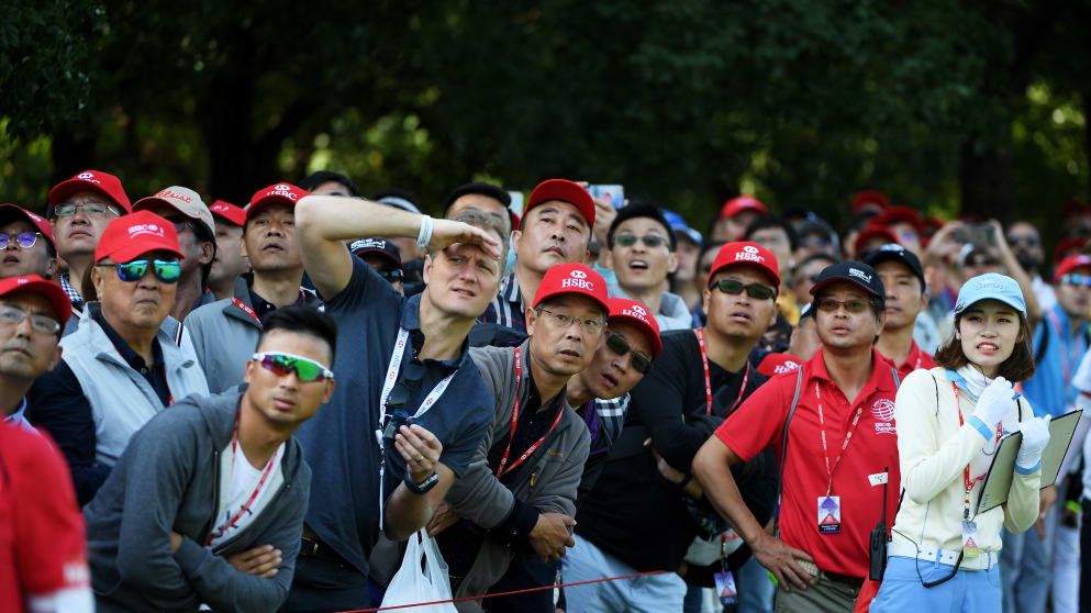 Fans watch play during the third round of the WGC - HSBC Champions