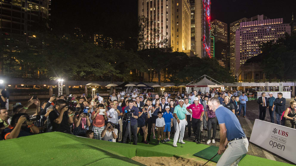 Dustin Johnson takes part in an Urban Golf Challenge in downtown Hong Kong