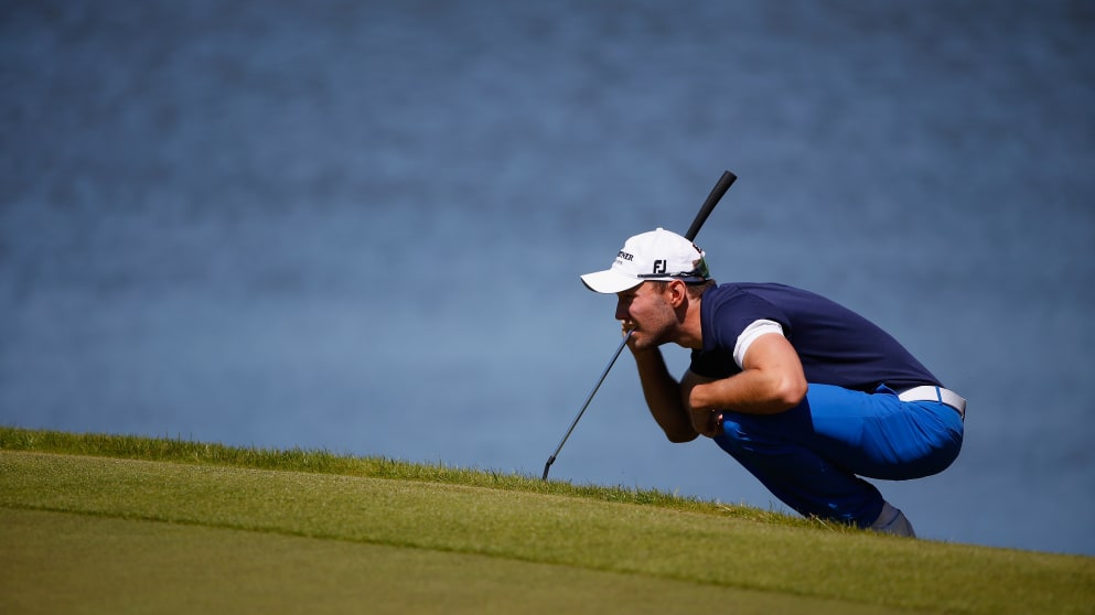 Maximilian Kieffer lines up a putt on the 18th