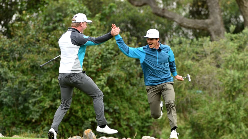 Thorbjorn Olesen and Morten Orum Madsen celebrate while filming The fastest hole of golf