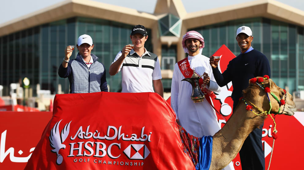 (L to R) Rory McIlroy, Justin Rose and Tiger Woods enjoy coffee with a camel
