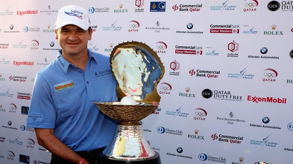 Paul Lawrie of Scotland poses with the Qatar Masters Pearl Trophy