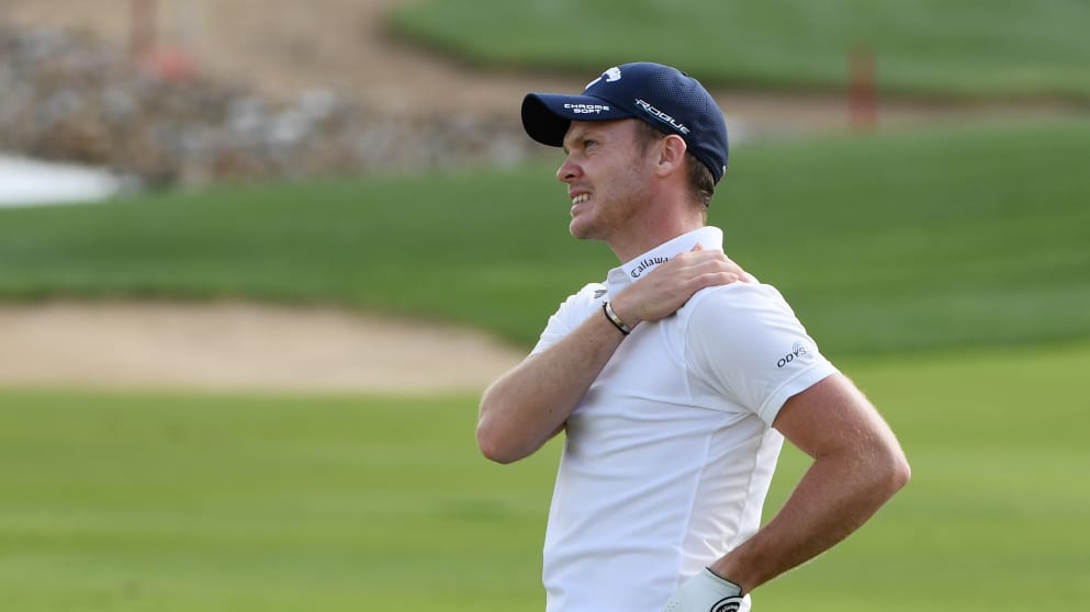 Danny Willett holds his shoulder