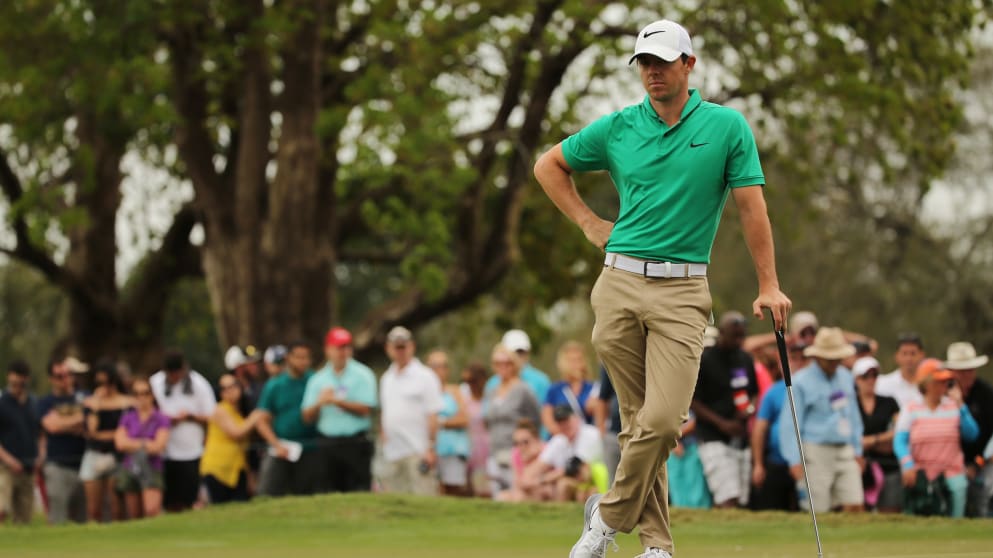 Rory McIlroy weighing up his putt on seven