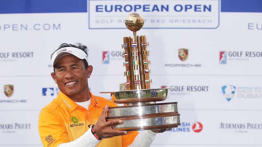 Thongchai Jaidee of Thailand poses with the winners trophy after victory in the final round of the Porsche European Open
