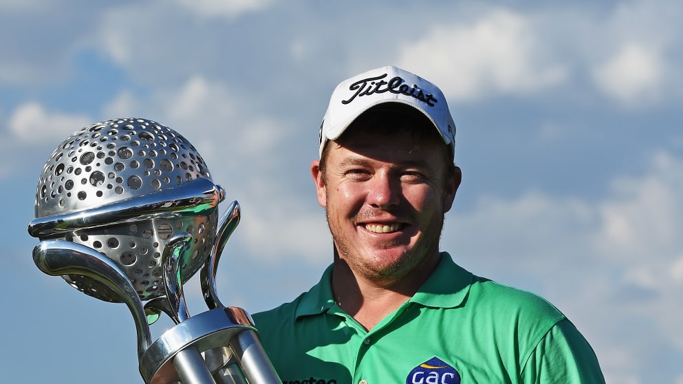 George Coetzee - poses with his second European Tour trophy after winning the Tshwane Open