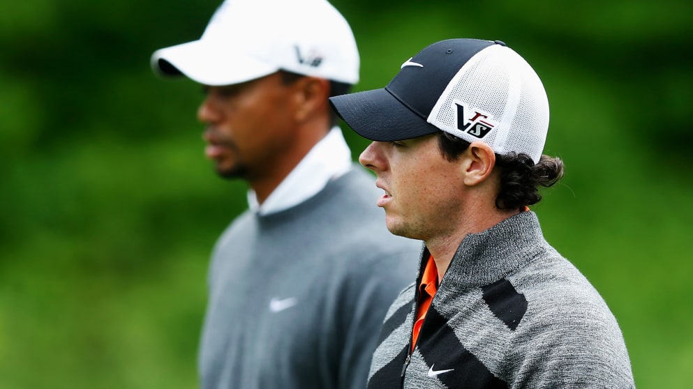 ARDMORE, PA - JUNE 14:  (L-R) Tiger Woods of the United States and Rory McIlroy of Northern Ireland walk together on the 13th hole during Round Two of the 113th U.S. Open at Merion Golf Club on June 14, 2013 in Ardmore, Pennsylvania.  (Photo by Scott Hall