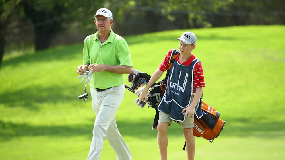 Kevin Stone with his son Jarryd caddying for him