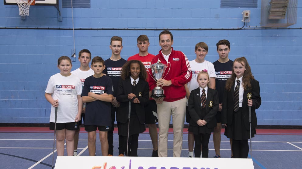 Nick Dougherty unveils the new British Masters trophy on a visit to The Buckingham School, near Woburn