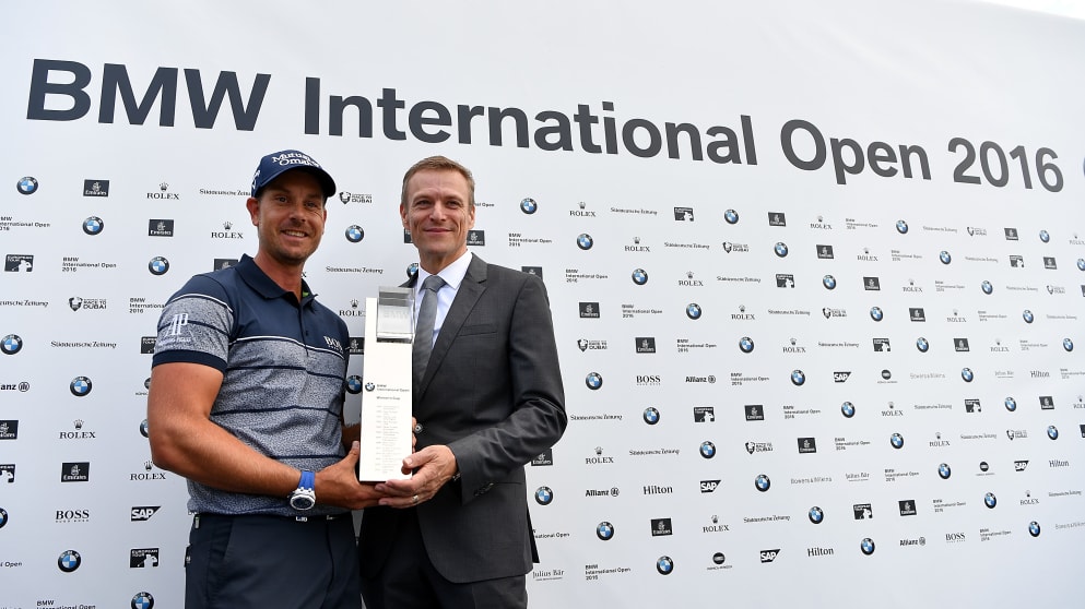 President of the BMW Group Sales Subsidiary, German Market Peter van Binsbergen presents Henrik Stenson  with the trophy 
