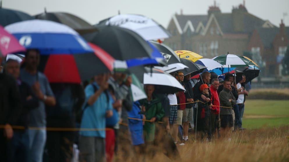 Fans watch the play on the first hole during the third round 