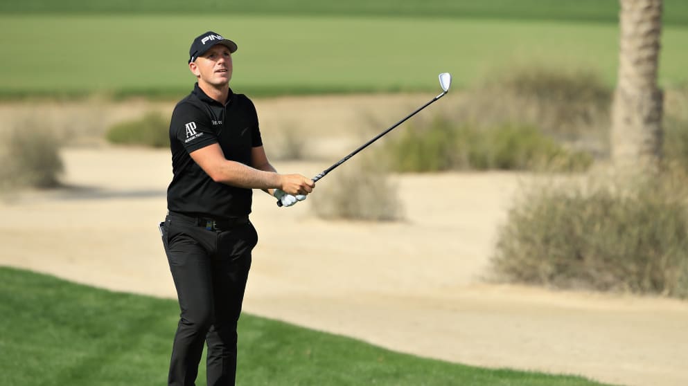 Matt Wallace of England takes his second shot on hole ten during Day Four