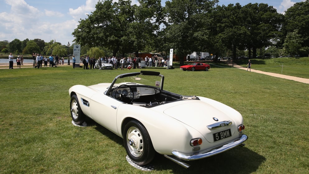 Justin Rose in Hyde Park with a BMW i8 in the foreground 