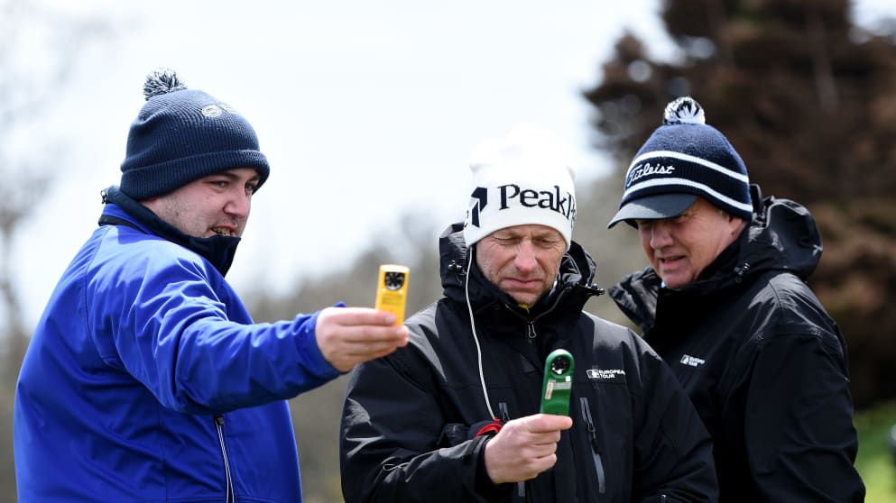 European Tour meteorologist Guy Nestor and European Tour referees Mikael Eriksson and  Thomas Waldenstedt check the wind speed during the delayed first round of the Madeira Islands Open 