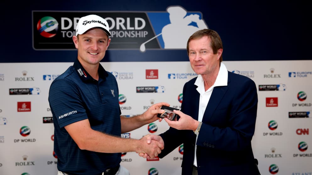 Justin Rose poses with his silver membership card after being made an Honorary Life Member of The European Tour by George O'Grady, Chief Executive
