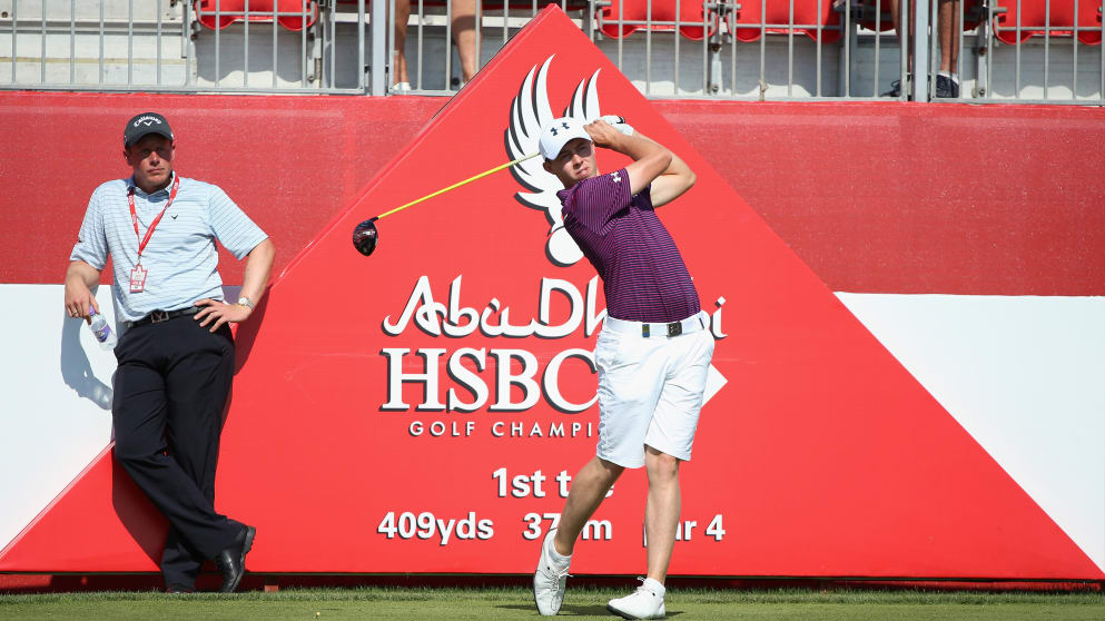 Matthew Fitzpatrick of England is watched by his coach Mike Walker