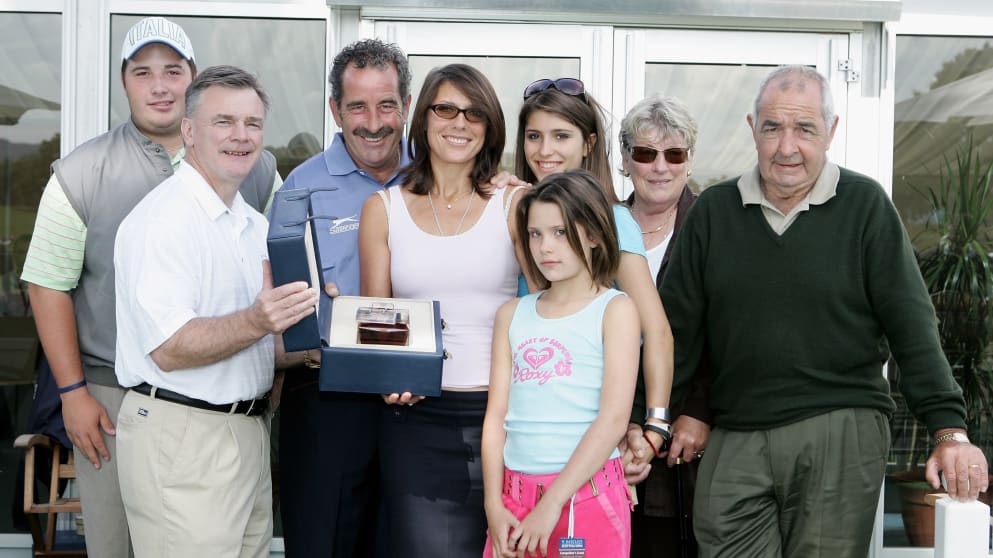 Bob Torrance (R) and family as son Sam is presented with a bottle of whisky from Ken Schofield