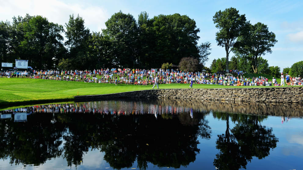 Fans watch the play on the 15th green during the first round of the 95th US PGA Championship