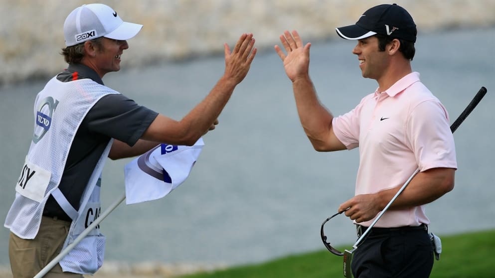 Paul Casey celebrates with his caddie Christian Donald